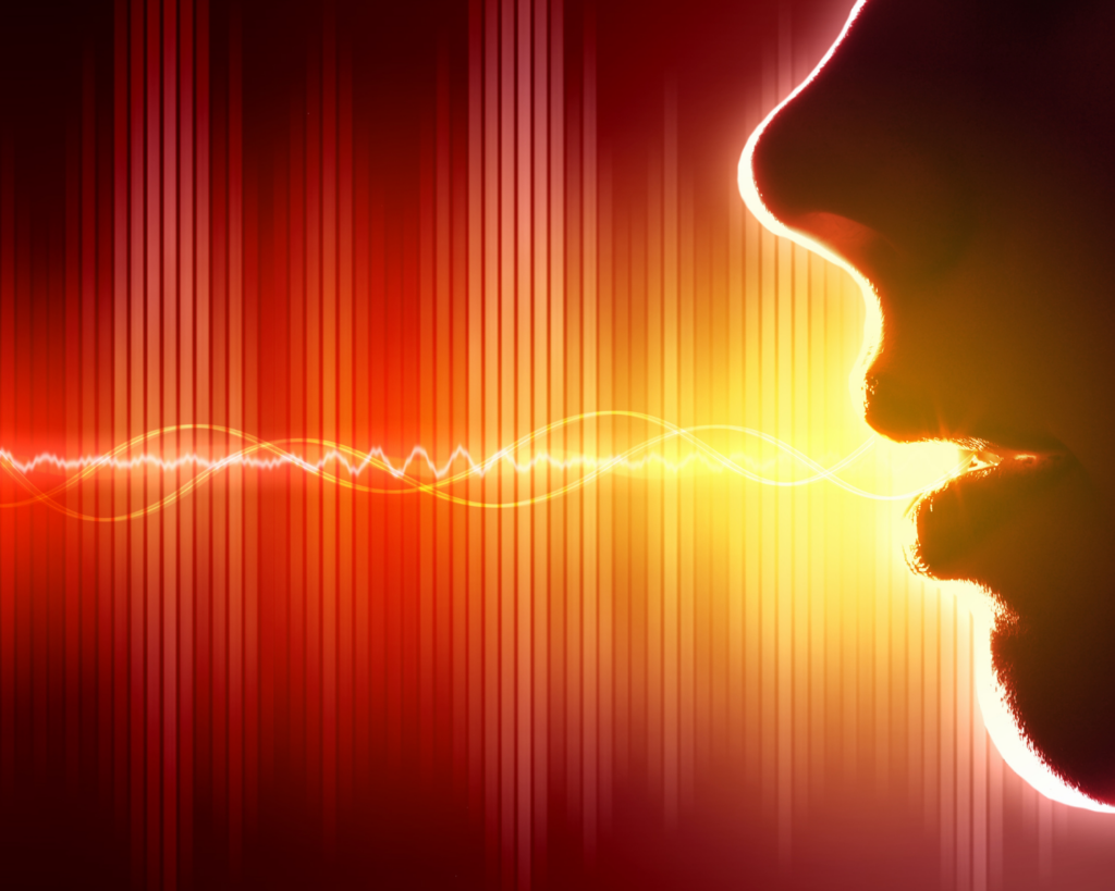 Side profile silhouette of a face speaking, with glowing sound waves emanating from the open mouth against a dramatic red and orange gradient background with vertical lines suggesting audio frequencies.