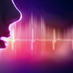 Profile silhouette of a face with colorful digital sound waves emanating from the mouth. The audio waveform visualization features vertical bars in vibrant pink, purple, orange, and yellow hues against a deep purple-blue gradient background, representing voice or speech as visible sound frequencies.